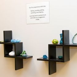 A display of clay artwork done by children at Strong Start