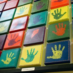 Hand print artwork by children at Strong Start Early Learning Center