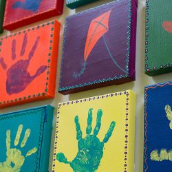 Hand print artwork by children at Strong Start Early Learning Center