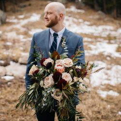A Groom Holding Her Stunning Bouquet