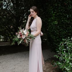 A stunning bride and her Bliss bridal bouquet.