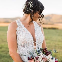 Her and her bouquet are both stunning.