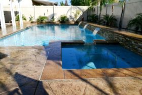 Geometric swimming pool with hot tub.