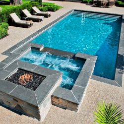 Pool with fireplace hardscape.