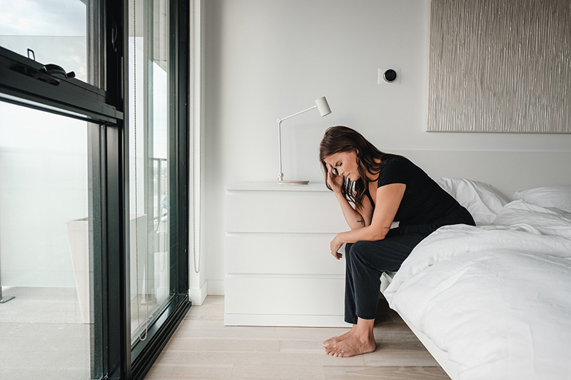 frustrated woman can't sleep because partner snores