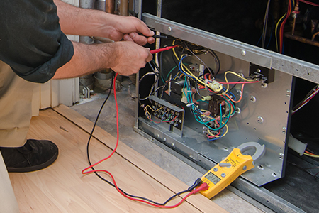 Man working on a heat pump