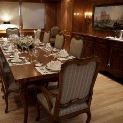 Image of 10-person dining table with custom interior created by Dennis Boatworks.