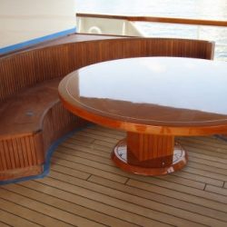 An image of a custom made circular dining booth by Dennis Boatworks.
