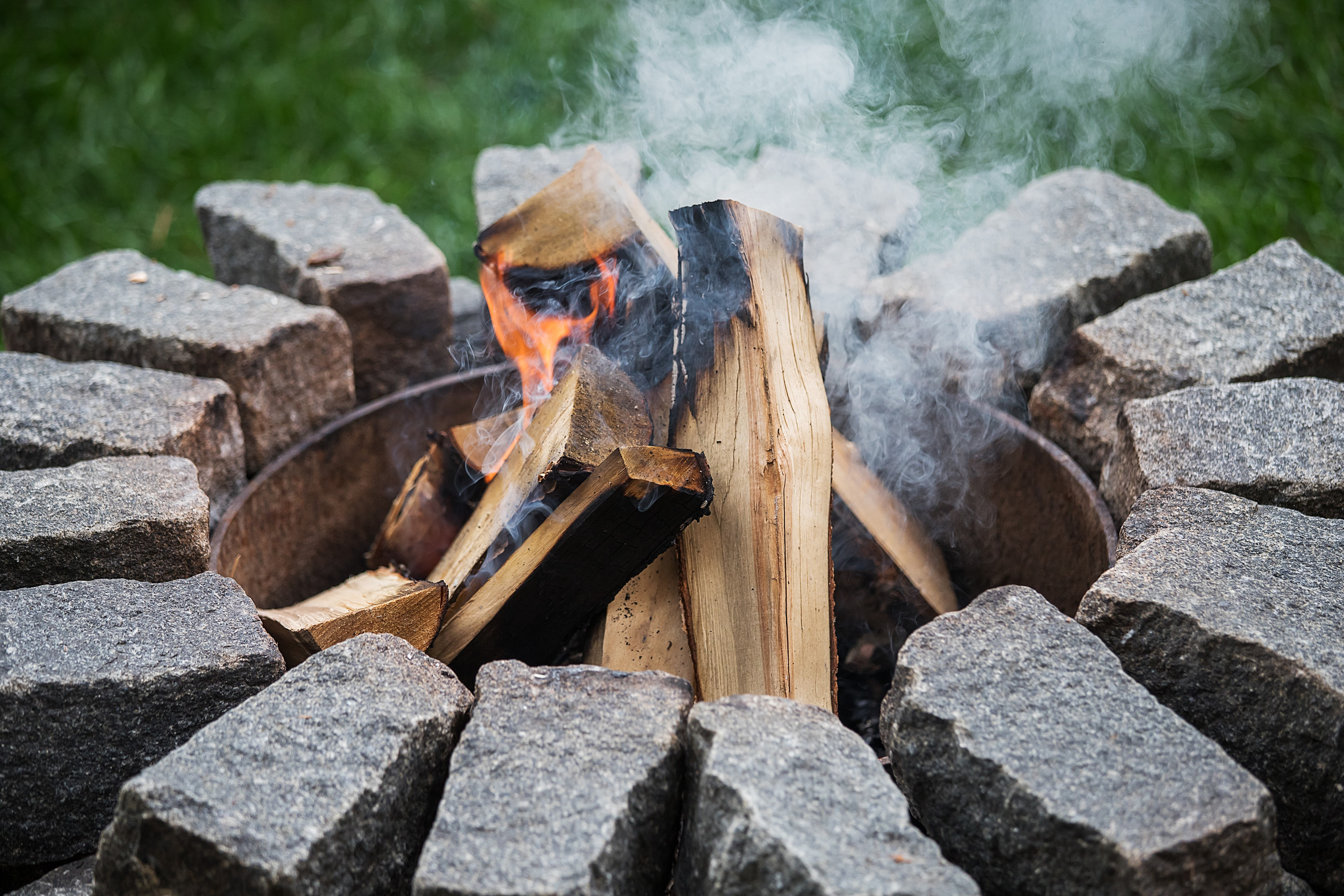 fire pit with a fire going on the inside