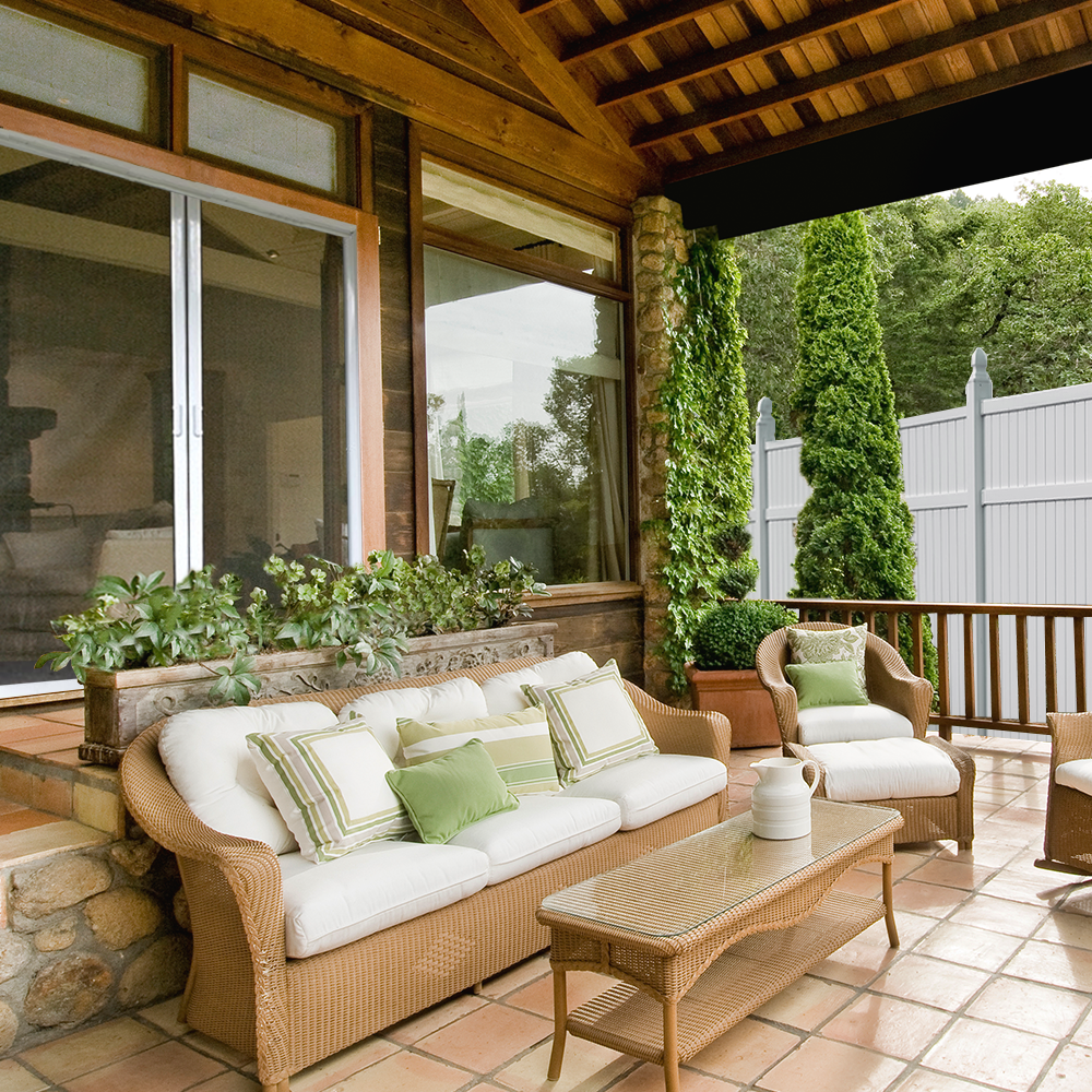 vinyl privacy fence in a backyard with a patio