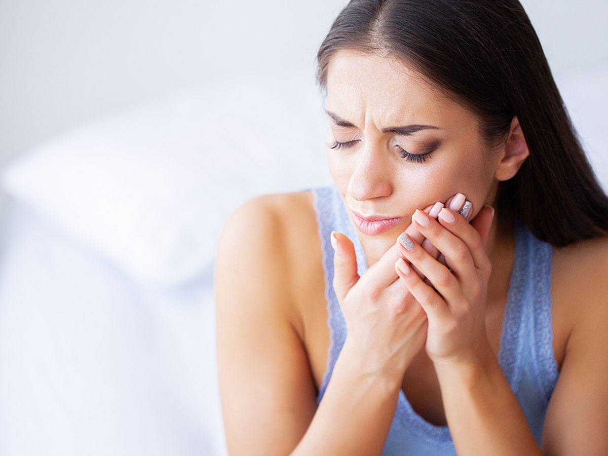 Woman Feeling Tooth Pain