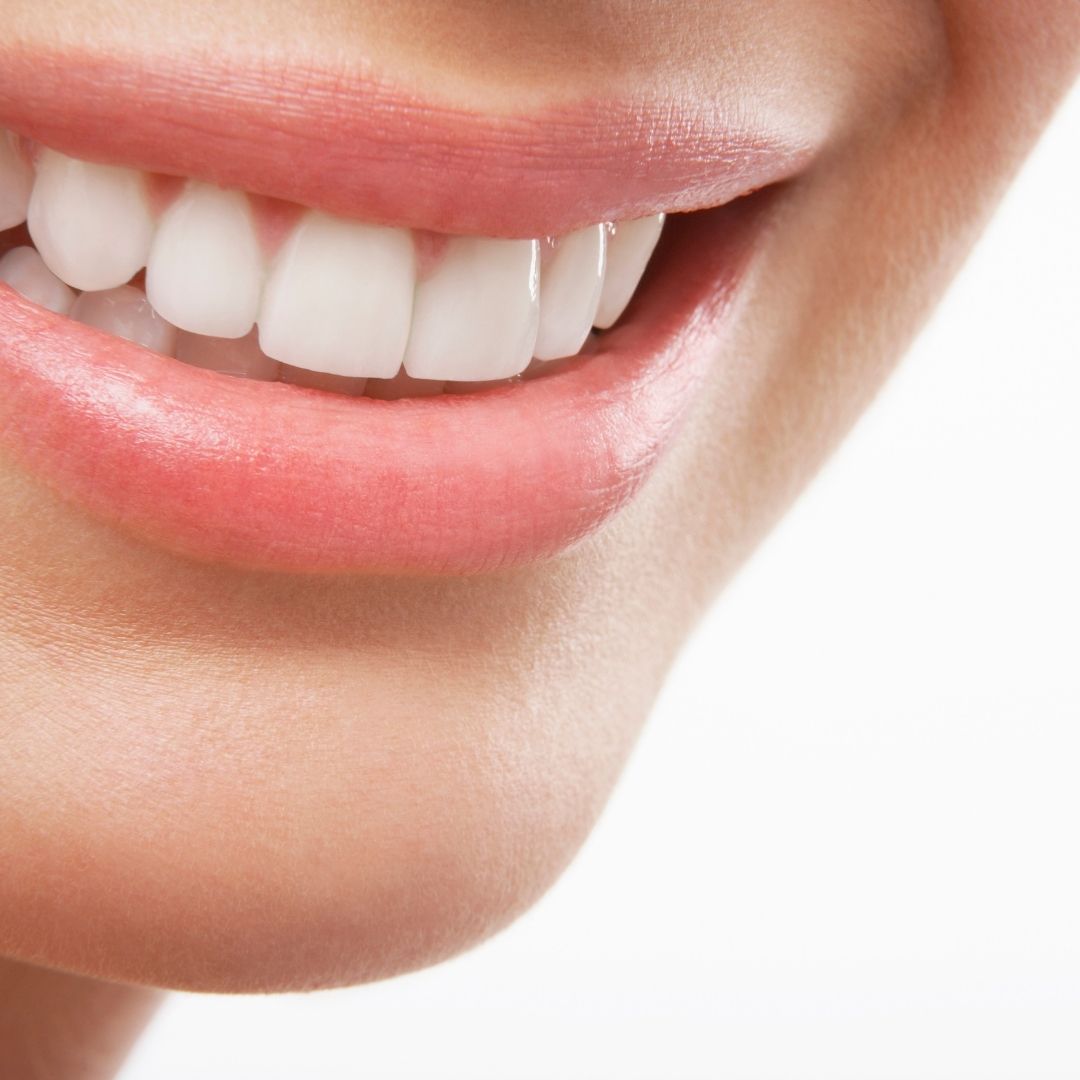 close up photo of woman's smile