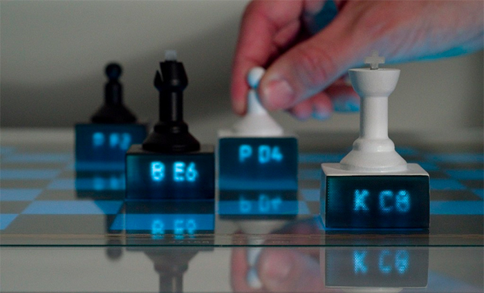 3D printed chess pieces with light pipes on an interactive tabletop that suggest your next move
