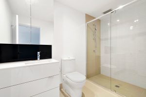 sink, toilet, shower in white bathroom