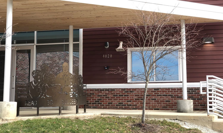 Indy STEAM Academy school entrance with tree, door and stairs