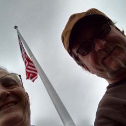 Two guys taking a selfie with their installed American flag pole - ND Flag Pole Guy