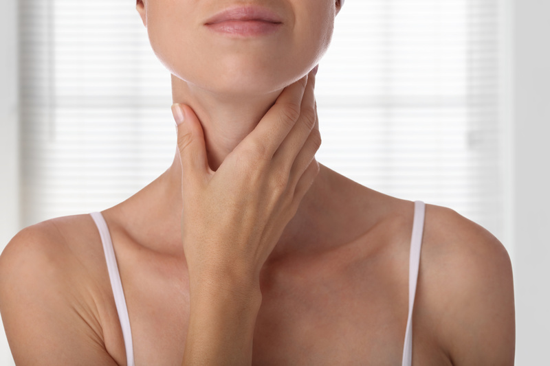 Woman thyroid gland control isolated on white background