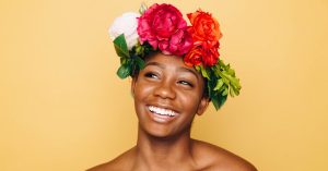 Beautiful smiling woman wearing a flower crown.
