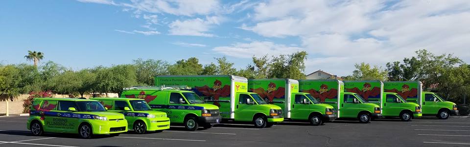 Fleet of Robins Plumbing cars and trucks lined up (8 vehicles total)