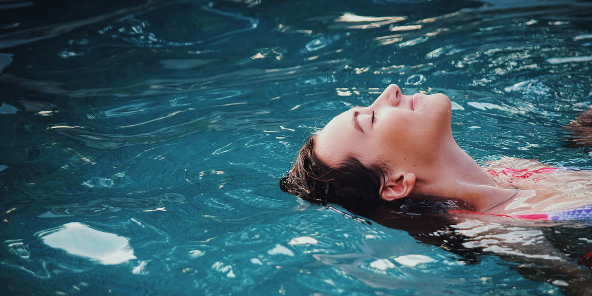 woman in backyard pool