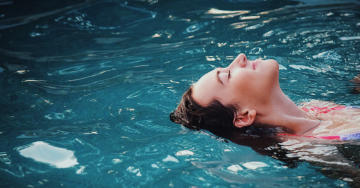 woman in backyard pool