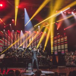 David Aaron Carpenter playing violin with touring musical event Rocktopia.
