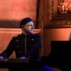 Henry Aronson playing piano with Rocktopia – a touring classical music and classic rock concert.