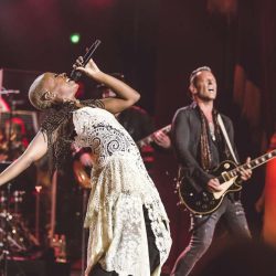Kimberly Nichole singing onstage with Rocktopia.