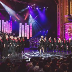 Rocktopia’s choir performing live on stage.