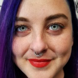 Septum piercing with a 16 gauge hanging hinged hoop.