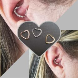 Daith piercing with a 16 gauge heart-shaped hoop with 9 CZ stones.