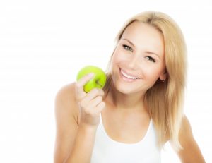 Woman eating apple.