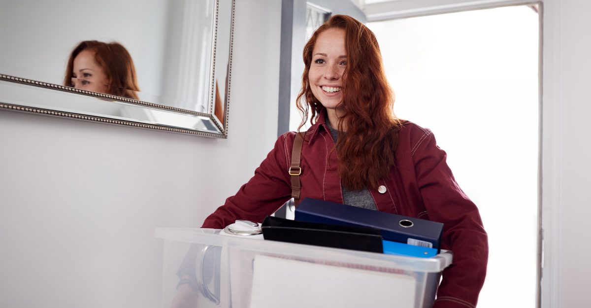 young woman moving into a new apartment