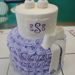 purple rosettes, white bow, cakes in dallas, baby shower cakes dfw, arlington specialty cakes, baby shower cakes in Arlington texas, frisco baby shower bakery, dallas texas cake bakery, baby shower cakes in fort worth, dallas baby shower cakes, southlake baby shower cakes, plano baby shower cakes, grand prairie baby shower cakes bakery, hurst cake bakery, Euless baby shower cakes, richland hills baby shower cakes, baby buggie birthday cakes, baby shower cakes in arlington