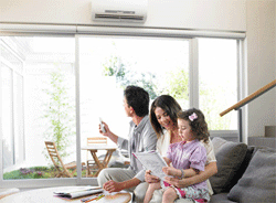 family controlling heating and air conditioning