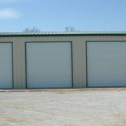 Enclosed Metal Garage with Three Rolling Garage Doors