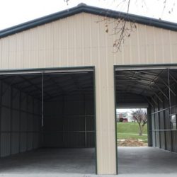 Enclosed Metal Garage with Three Rolling Garage Doors